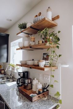 the kitchen counter is clean and ready to be used as a coffee bar or breakfast bar