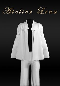 a white suit and tie on display in front of a black background with gold lettering