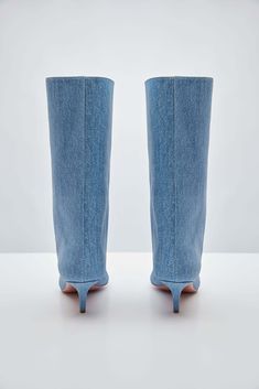 For Spring/Summer 2024, Amina Muaddi played with the idea of trompe l'œil by crafting a pair of thigh-high suede boots with a denim print. Spring Denim Knee-high Boots, Spring Knee-high Denim Boots, Denim Knee-high Boots For Spring, Denim Summer Boots, Blue Fitted Knee-high Boots For Spring, Fitted Denim Summer Boots, Fitted Blue Knee-high Boots For Spring, Fitted Denim Boots For Summer, Chic Denim Blue Boots For Spring