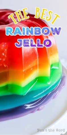 a rainbow jello cake with the words, the best rainbow jello