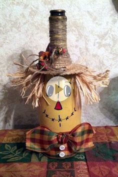 a scarecrow hat is sitting on top of a vase