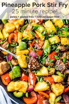 pineapple pork stir fry in a skillet with peppers, onions and other vegetables