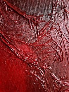 an abstract painting with red paint on it