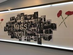 a wall that has some pictures on it with flowers in front of it and the words miss you