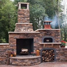 an outdoor fireplace made out of bricks and logs