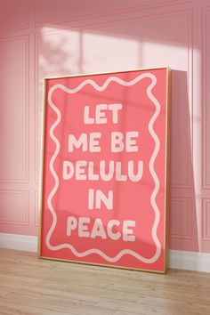 a pink poster with the words let me be deluu in peace on it