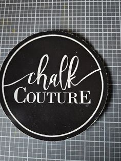 a black and white sticker with the word'half couture'on it