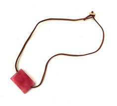 Organic Tagua Nut Rectangular Pendant * 21.5 Necklace Length Leather Stap * Organic Rectangular Pendant * Pendant Height: 23mm * Pendant Width: 4mm * Pendant Length: 32mm * Handmade in Ecuador This Product is handcrafted from a palm tree nut native to the lush tropical rainforests of Ecuador. Also referred to as the Ecuadorean Ivory Palm, the Tagua tree produces several bushels of seed pods a year with up to 100 Tagua nuts per pod. These nuts are then harvested, dried, and crafted into a wide ra Adjustable Necklace With Rectangular Pendant, Necklaces With Adjustable Chain And Square Pendant, Minimalist Adjustable Rectangular Necklace, Adjustable Rectangular Necklace With Lobster Clasp, Handmade Adjustable Rectangular Necklace, Tagua Necklace, Ivory Necklace, Tagua Jewelry, Tagua Nuts