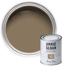 a brown paint can with an open tin