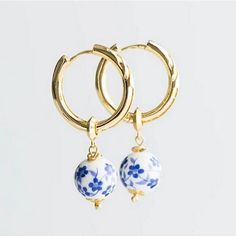 Offers Welcome These Anthropologie Blue Floral Huggie Hoop Earrings Are Made Of White Ceramic Floral Blue Beads In Between Little Gold Spacer Beads That Hang From Gold Huggie Hoop Earrings. Gold Huggie Hoop Earrings, Vintage Silver Earrings, Anthropologie Jewelry Earrings, Gem Earrings, Anthropologie Jewelry, Holiday Earring, Huggie Hoop Earrings, Geometric Earrings, Circle Earrings