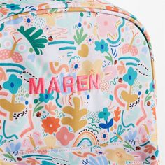 A floral backpack that's extra comfy and ready to handle daily adventures. Patterned with a colorful collection of garden friends that flit and flutter over the white exterior, the kids' large knapsack is constructed of supremely durable polyester made from recycled water bottles. A roomy interior holds everything your kid needs-books, school supplies, extra layers-and there's a padded pocket to keep their tablet protected. Outside pockets hold snacks, water bottles and more. Pair this book bag Multicolor School Bag For Spring, White Backpack For Spring, White School Backpack For Spring, Floral Print Backpack For School In Spring, Green Standard Backpack For Spring, Playful White Bags For Spring, Green Spring Standard Backpack, Playful Bags For Spring Playtime, White Backpack For Daycare