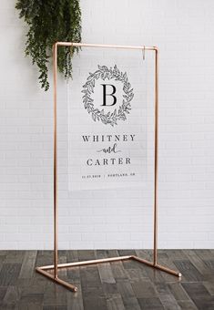 a white brick wall with a sign that says whitney and cartner