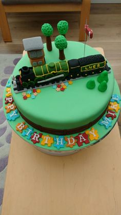 a birthday cake with a train on it