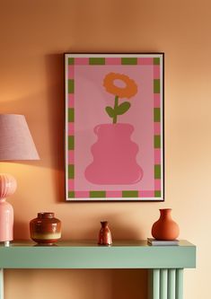 a painting on the wall above a table with two vases and a lamp next to it