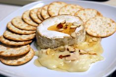 a plate with crackers and cheese on it