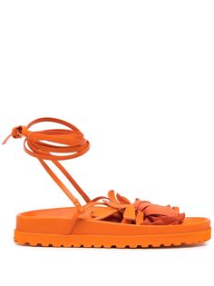 leather pumpkin orange floral appliqué open toe tie-fastening ankle strap branded leather insole ridged rubber sole Orange Sandals With Rubber Sole For Spring, Spring Orange Sandals With Rubber Sole, Orange Single Toe Strap Sandals For Spring, Spring Calf Leather Sandals With Rubber Sole, Leather Pumpkin, Orange Accessories, Floral Applique, Pumpkin Orange, Shades Of Orange