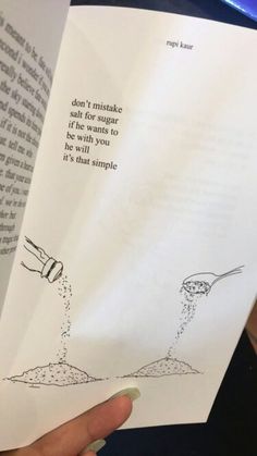 someone is holding up a book with an illustration on it