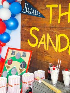 there is a sign that says the sandlots and some drinks are on the table