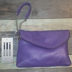 Purple Leather Ili Handbag Clutch Clutch Bag With Fold Over Clasp For Everyday Use, Everyday Clutch With Fold Over Clasp, Everyday Clutch Bag With Fold Over Clasp, Purple Clutch Bag For Everyday Use, Versatile Clutch With Fold Over Clasp For Everyday Use, Purple Clutch With Removable Pouch For Daily Use, Purple Clutch Wallet For Everyday, Everyday Crossbody Clutch With Fold Over Clasp, Trendy Purple Clutch For Daily Use