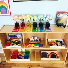 a wooden shelf filled with lots of toys