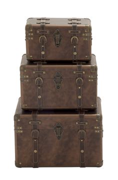 three brown suitcases stacked on top of each other