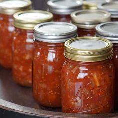 many jars filled with different kinds of food