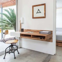 a white desk with a wooden shelf on it