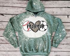 a green and white hoodie with the word mama on it