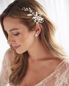 a woman wearing a bridal hair comb