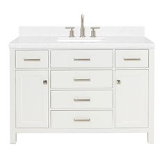 a white bathroom vanity with two sinks and no faucets on the counter top