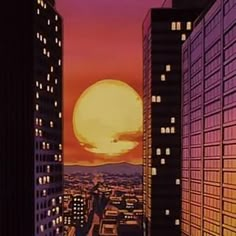 the sun is setting behind some tall buildings