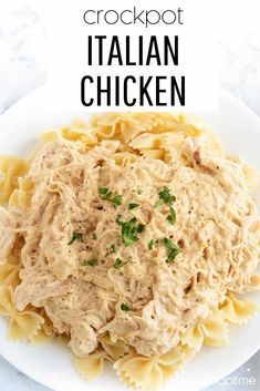 a white plate topped with chicken and pasta