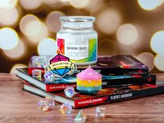 a candle and some books on a table