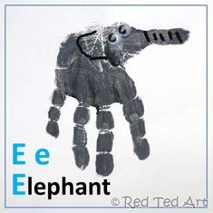 a hand made out of paper with the words ee elephant on it