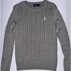 This Polo Ralph Lauren Grey Cable-Knit Cotton Crewneck Sweater In Size Medium Is A Timeless Classic. It’s Never Been Worn And Is In Perfect Condition, Offering Both Style And Comfort. The Cable-Knit Texture Adds A Touch Of Sophistication To This Cozy, Versatile Sweater. Fitted Crew Neck Polo Sweater, Classic Long Sleeve Knitted Polo Sweater, Casual Long Sleeve Cable Knit Polo Sweater, Textured Knit Long Sleeve Polo Sweater, Long Sleeve Cable Knit Polo Sweater, Cable Knit Long Sleeve Polo Sweater, Classic Gray Knitted Sweater, Casual Textured Knit Long Sleeve Polo Sweater, Knit Polo Sweater With Ribbed Collar