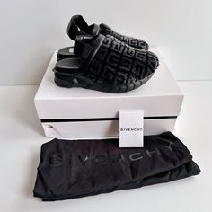 Givenchy ‘Marshmallow’ 4g Logo Shearling Clogs Slingback Mules Plush, Cozy Monogram Printed Clogs On A Lightweight Molded Rubber Soles Comes Brand New In Box, 2 Dust Bags, & Booklet (Slight Scuffs On Footbed & Small Tear On Shoe Box From In Store Handling) 100% Authentic Size: Women’s Eu 37 (Approx. Us 7) Color: Black Retail Price: $975 Details: O Round Toe O Slingback Strap O Approx. 2” Platform O Padded Footbed O Made In Italy Materials: Shearling Upper, Leather Lining, And Rubber Sole Luxury Black Round Toe Clogs, Shearling Clogs, Backless Loafers, Slingback Mules, Givenchy Shoes, Black Leather Flats, Leather Heels Sandals, Givenchy Women, Monogram Prints