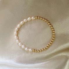 14k Gold filled - Handcrafted- Hypoallergenic- Waterproof This cute bracelet is half 14k gold filled beads and half white freshwater pearls. Hand strung on a stretchy band. Made in California. White Pearl Stretch Bracelet Dainty Style, Hypoallergenic White Pearl Bracelet In 14k Gold Filled, Hypoallergenic White Pearl Bracelet In 14k Gold, Everyday White Pearl Stretch Bracelet, White Freshwater Pearl, Cute Bracelets, Pearl Bracelet, Fresh Water, Freshwater Pearls