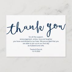 a white thank card with the words, thank you on it and blue ink writing