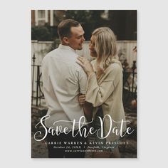 save the date card with an image of two people hugging and looking into each other's eyes