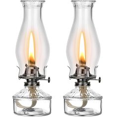 two clear glass lamps with yellow flame on each candle holder, one has a wire wrapped around the base