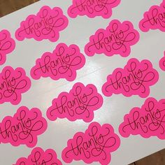 pink stickers with the words thank written on them