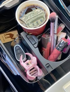 the contents of a car are neatly organized in this compartment, including makeup and other personal care items