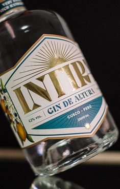 a close up of a bottle of gin on a table