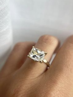 a woman's hand with a ring on it