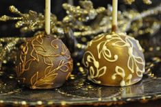 three chocolate covered cake pops sitting on top of a table