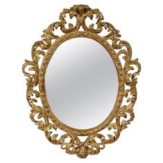 an ornate gold framed mirror on a white background