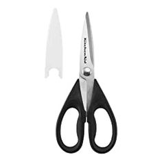 a pair of scissors and a knife on a white background