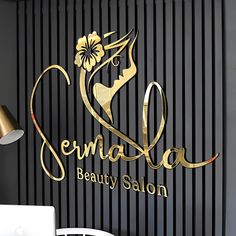 there is a logo on the wall for a beauty salon