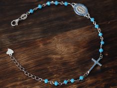 Turquoise rosary beads bracelet for her, sterling silver rosary bracelet, Miraculous Medal rosary bracelet, dainty rosary beads bracelet . Sterling silver rosary beads bracelet with rhodium plating ( doesn't tarnish or change color ) this beautiful bracelet is 18 cm with extension 21 cm so it is suitable for any size of wrist. Blue zircon is symbol of Our Lady Virgin Mary and Blue Cross as place in Medjugorje where Our Lady appeared many times. Nickel-free Sterling Silver Rosary Bracelet, Turquoise Rosary Bracelet With Round Beads As Gift, Turquoise Rosary Bracelet Gift, Sterling Silver Rosary Bracelet With Round Beads, Sterling Silver Rosary Bracelet With Round Beads As Gift, Sterling Silver Rosary Bracelet Gift, Handmade Turquoise Rosary Bracelet As Gift, Nickel-free Rosary Bracelet As Gift, Turquoise Rosary