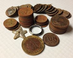 an assortment of coins and other items on a table